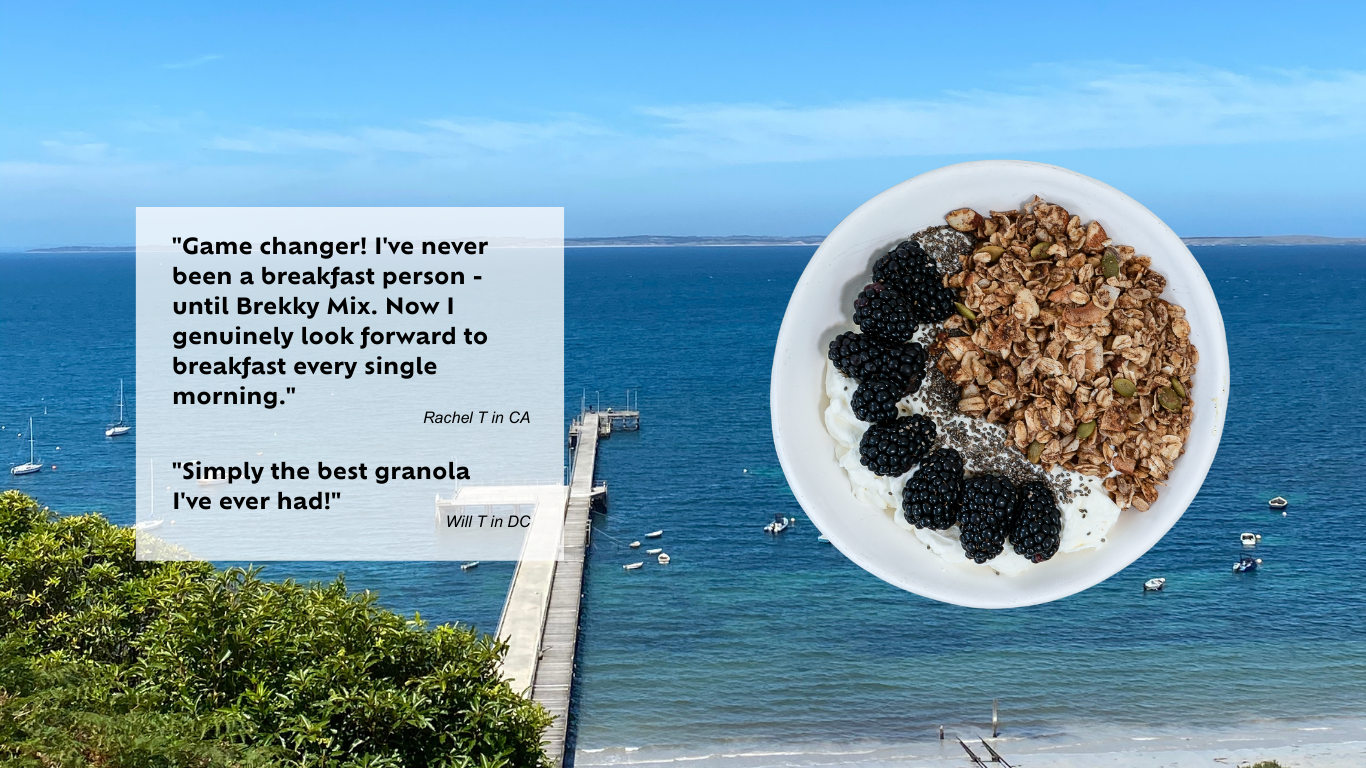 Brekky Mix customer reviews and a plate of healthy Brekky Mix granola with blackberries set over a beach with a pier and ocean view