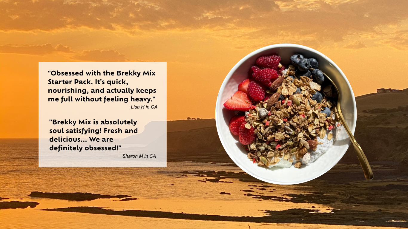 Bowl of healthy granola with berries against a sunset sky with clouds over the sea background