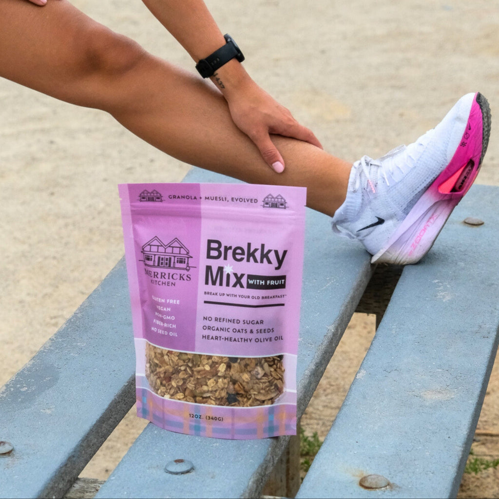 Brekky Mix With Fruit - healthy low sugar granola with fruit on a park bench with a runner stretching behind