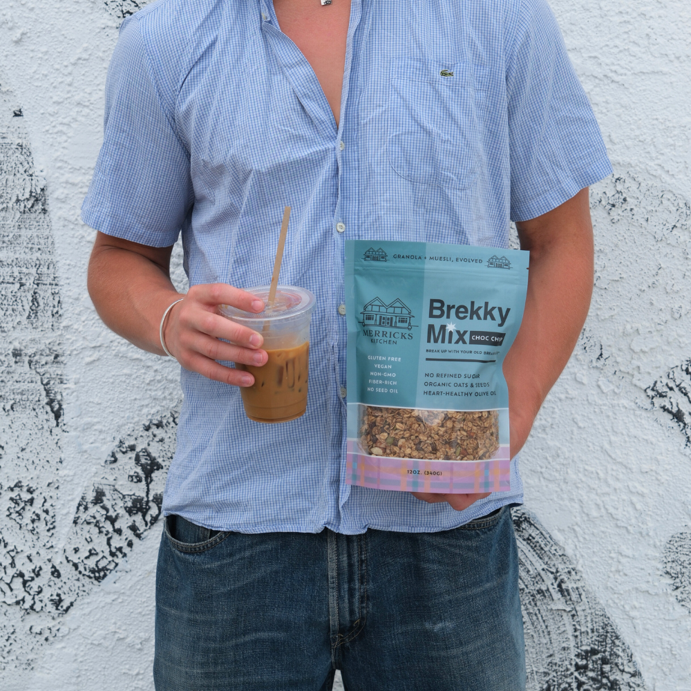 Person holding healthiest chocolate granola Brekky Mix Choc Chip with only 2g added sugar and zero sodium